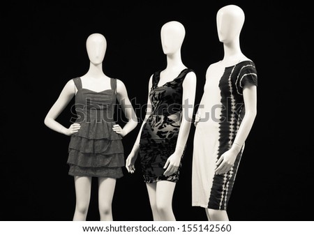 Three mannequin dressed in sundress in black and white Ã¢Â?Â?black background