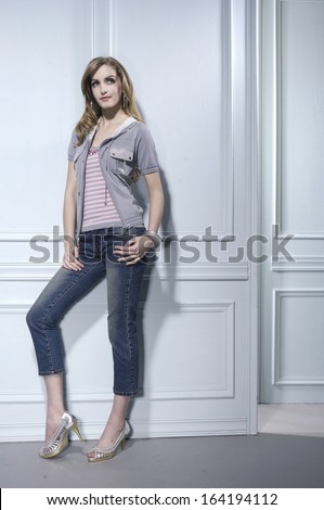full-length portrait of young model in near door posing