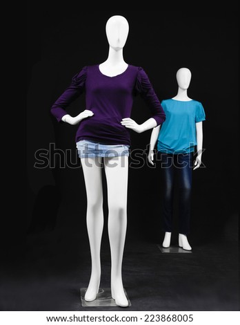 Set of two mannequin shirt and jeans on black background