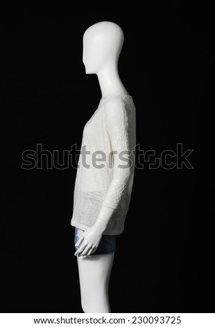 Side view mannequin female dressed in short on black background