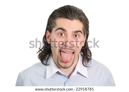 Young dark haired man in light blue striped shirt shows his tongue isolated on white