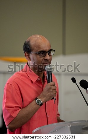 Singapore - October 19, 2013: Singapore\'s Deputy Prime Minister and Minister of Finance speaks at a public seminar. Mr. Shanmugaratnam is a Member of Parliament for Singapore\'s People\'s Action Party.