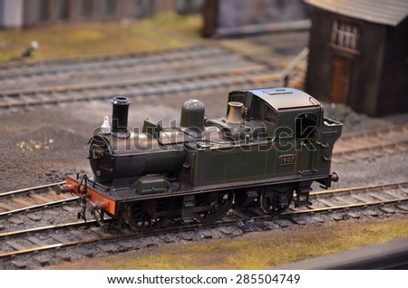 Birmingham, England - November 24, 2012: A green British railways model steam engine numbered 1407 stationary on railway tracks.