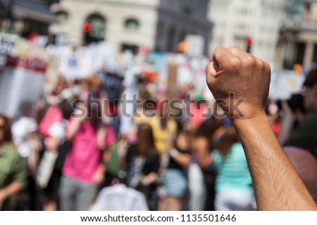 Similar – Image, Stock Photo Peace demonstration against the war of aggression against Ukraine started by Putin. Demonstrator in the national colors of Ukraine holding up a sign. Rear view