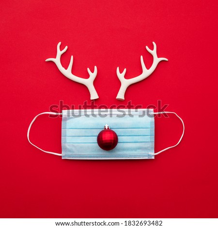 Similar – Image, Stock Photo Merry Christmas.Protective surgical mask with christmas ornament