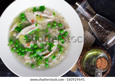 Chicken soup with green peas, pearl barley, chili pepper, diet dish