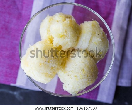 Lemon ice cream sorbet, balls in glass, refreshing summer diet dessert