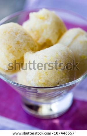 Lemon ice cream sorbet, balls in glass, refreshing summer diet dessert