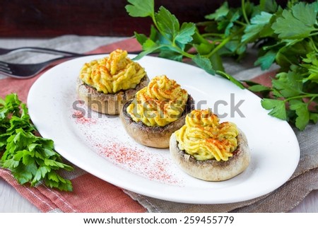 Stuffed caps  mushroom champignon yellow mousse lentils, tasty snack, appetizer