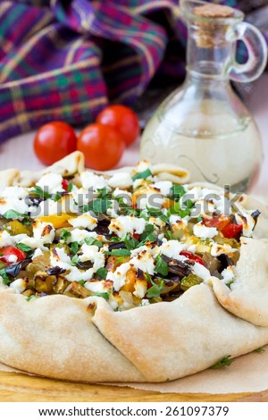 Vegetable pie with eggplant, zucchini, peppers, feta cheese, parsley, Greek dish