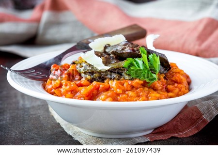 Tomato risotto, red rice with fried chicken liver, onions, homemade Italian dish