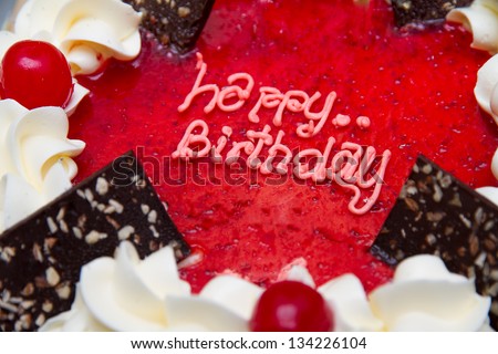 close up the word &amp;quot;Happy Birthday&amp;quot; on the cake. - stock photo