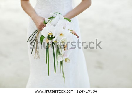 the bride holding the wedding bouquet