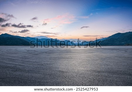 Similar – Image, Stock Photo On the road by car driving through wide forest to the mountains in background.