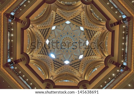 ABU DHABI, UAE - MARCH 17: Central dome of Emirates Palace hotel on March 17, 2010. Emirates Palace is a luxurious and the most expensive 7 star hotel designed by John Elliott RIBA.