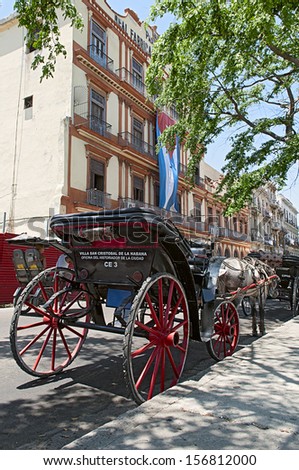 LA HABANA, CUBA - APRIL 22, 2009. Horse carriage in front of a Partagas, Tobacco factory in La Habana, Cuba on April 22, 2009. Cuba\'s government now allows private small business as employment option.