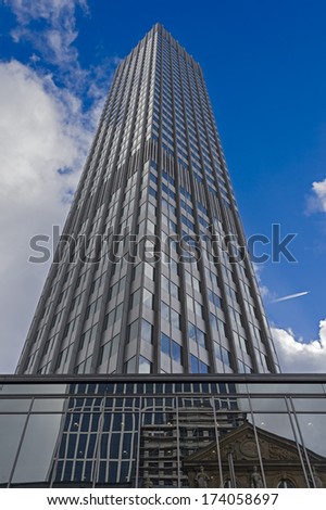 FRANKFURT, GERMANY - JANUARY 27, 2014. Bottom view of skyscraper in the central business district of Frankfurt am Main, Germany on January 27, 2014. Frankfurt is the largest financial centre in Europe