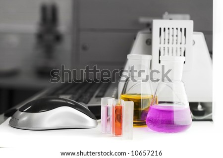 laboratory flasks and computer mouse