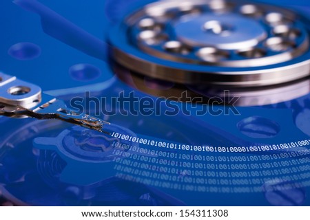 HDD Internals of a computer hard drive with binary number reflections with sepia colors