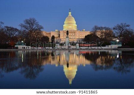 Capitol Building and mirror reflection on pond  in sunrise, Washington D.C. United States