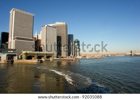 New York City - Staten Island Ferry Terminal and Brooklyn Bridge in a clear sky