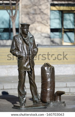 WASHINGTON, D.C. - JAN 20, 2013: Lone Sailor Statue at Navy Memorial which honors those who served  in the Navy, Marine Corps, Coast Guard, and the Merchant Marine.