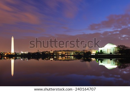 Washington DC - Thomas Jefferson Memorial  and Washington Monument at night with mirror reflections on water.