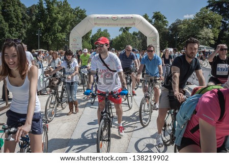 MILAN, ITALY - MAY 12: Cyclopride meeting in Milan MAY 12, 2013. Thousands of people pedal together through the town to launch their ecological message for a more sustainable mobility