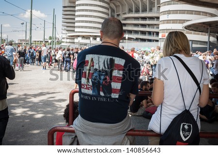 MILAN, ITALY - JUNE 3: Thousands of fans at Springsteen world tour in Milan JUNE 3, 2013. Thousands of fans gather outside the stadium waiting for the gates to open at Bruce Springsteen world tour.