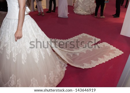 MILAN, ITALY - JUNE 21:  Detail of the train on wedding dress at SposaItalia, international exhibition of bridal and formal wear according to Italian style, on JUNE 21, 2013 in Milan