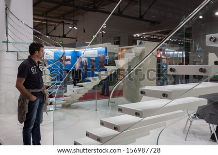 MILAN, ITALY - OCTOBER 3: Staircases and people at Made expo, international architecture and building trade show on OCTOBER 3, 2013 in Milan.