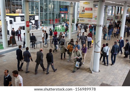 MILAN, ITALY - OCTOBER 3: Top view of people walking at Made expo, international architecture and building trade show on OCTOBER 3, 2013 in Milan.