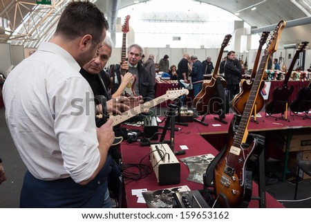 MILAN, ITALY - OCTOBER 20: People visit Milano Guitars & Beyond 2013, important trade show of string instruments with specific attention to guitars on OCTOBER 20, 2013 in Milan.