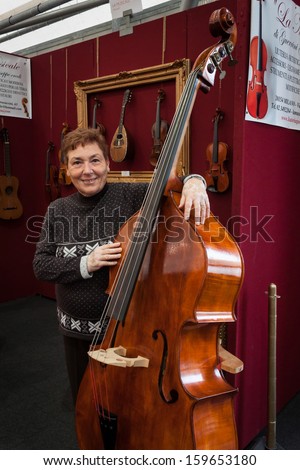 MILAN, ITALY - OCTOBER 20: Double bass at Milano Guitars & Beyond 2013, important trade show of string instruments with specific attention to guitars on OCTOBER 20, 2013 in Milan.