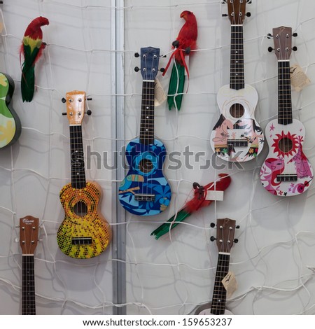 MILAN, ITALY - OCTOBER 20: Small guitars on display at Milano Guitars & Beyond 2013, important trade show of string instruments with specific attention to guitars on OCTOBER 20, 2013 in Milan.