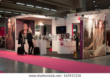 MILAN, ITALY - NOVEMBER 15: People visit Chibimart 2013, exhibition devoted to costume jewellery, fashion accessories, semi-precious stones and ethnic products on NOVEMBER 15, 2013 in Milan.
