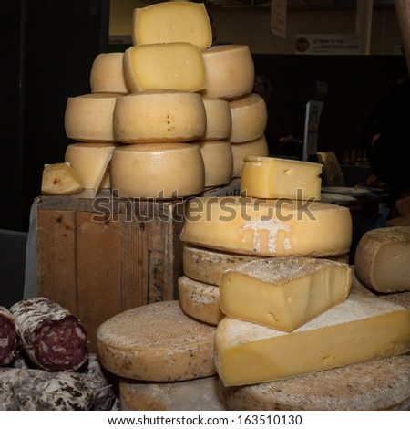 MILAN, ITALY - NOVEMBER 16: Cheese wheels at Golosaria, important event dedicated to culture and tradition of quality food and wine on NOVEMBER 16, 2013 in Milan.