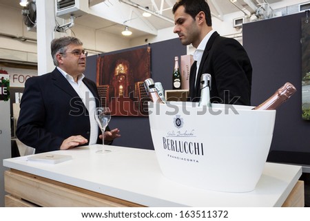 MILAN, ITALY - NOVEMBER 16: Italian winemaker at Golosaria, important event dedicated to culture and tradition of quality food and wine on NOVEMBER 16, 2013 in Milan.