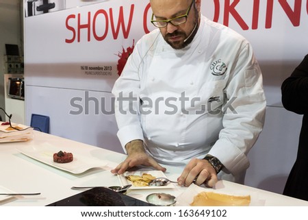 MILAN, ITALY - NOVEMBER 18: Chef works at Golosaria, important event dedicated to culture and tradition of quality food and wine on NOVEMBER 18, 2013 in Milan.