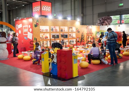 MILAN, ITALY - NOVEMBER 22: People visit Lego stand at G! come giocare, trade fair dedicated to games, toys and children on NOVEMBER 22, 2013 in Milan.