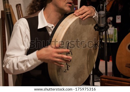 MILAN, ITALY - FEBRUARY 7: Musician playing percussion instrument at Olis Festival, event dedicated to holistic disciplines, alternative medicine and natural food on FEBRUARY 7, 2014 in Milan.