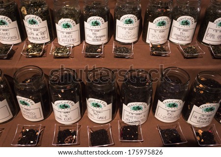 MILAN, ITALY - FEBRUARY 7: Jars with different types of tea on sale at Olis Festival, event dedicated to holistic disciplines, alternative medicine and natural food on FEBRUARY 7, 2014 in Milan.