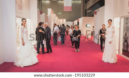 MILAN, ITALY - MAY 23: People visit Si\' Sposaitalia, ultimate exhibition for bridal and formal wear industry on MAY 23, 2014 in Milan.