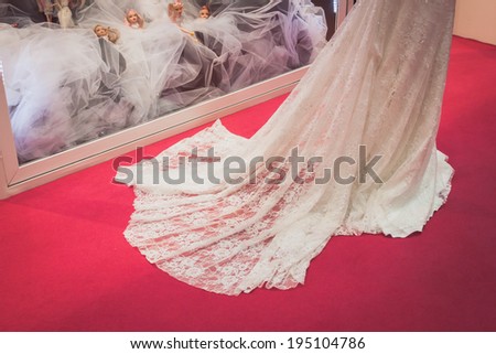 MILAN, ITALY - MAY 23: Detail of a beautiful wedding dress at Si\' Sposaitalia, ultimate exhibition for bridal and formal wear industry on MAY 23, 2014 in Milan.