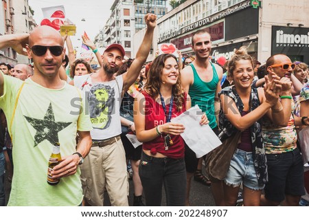 MILAN, ITALY - JUNE 28: People at gay pride parade in Milan JUNE 28, 2014. Thousands of people march in the city streets for the annual gay pride parade, claiming equality and legal rights.