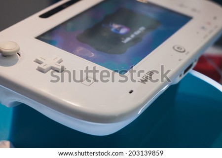 MILAN, ITALY - JULY 3, 2014: Close up of white Nintendo Wii U gamepad device. Nintendo is the world\'s largest video game company by revenue.