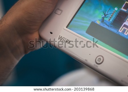 MILAN, ITALY - JULY 3, 2014: Close up of white Nintendo Wii U gamepad device. Nintendo is the world\'s largest video game company by revenue.