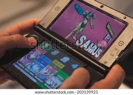 MILAN, ITALY - JULY 3, 2014: Close up of Nintendo 3DS portable game console. Nintendo is the world's largest video game company by revenue.