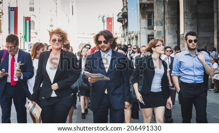 MILAN, ITALY - JULY 16: Business people take part in a flash mob to promote the official launch of The Wolf of Wall Street on DVD and Blue-Ray on July 16, 2014 in Milan.