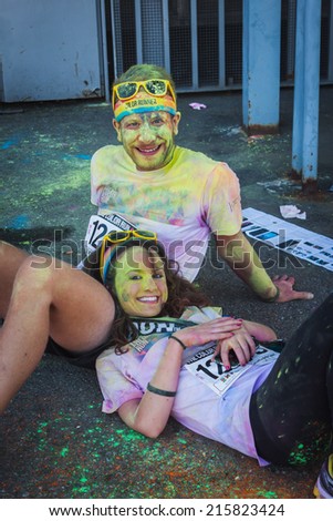 MILAN, ITALY - SEPTEMBER 6: Thousands of people take part in the Color Run event, the funniest and most colorful urban running ever on SEPTEMBER 6, 2014 in Milan.